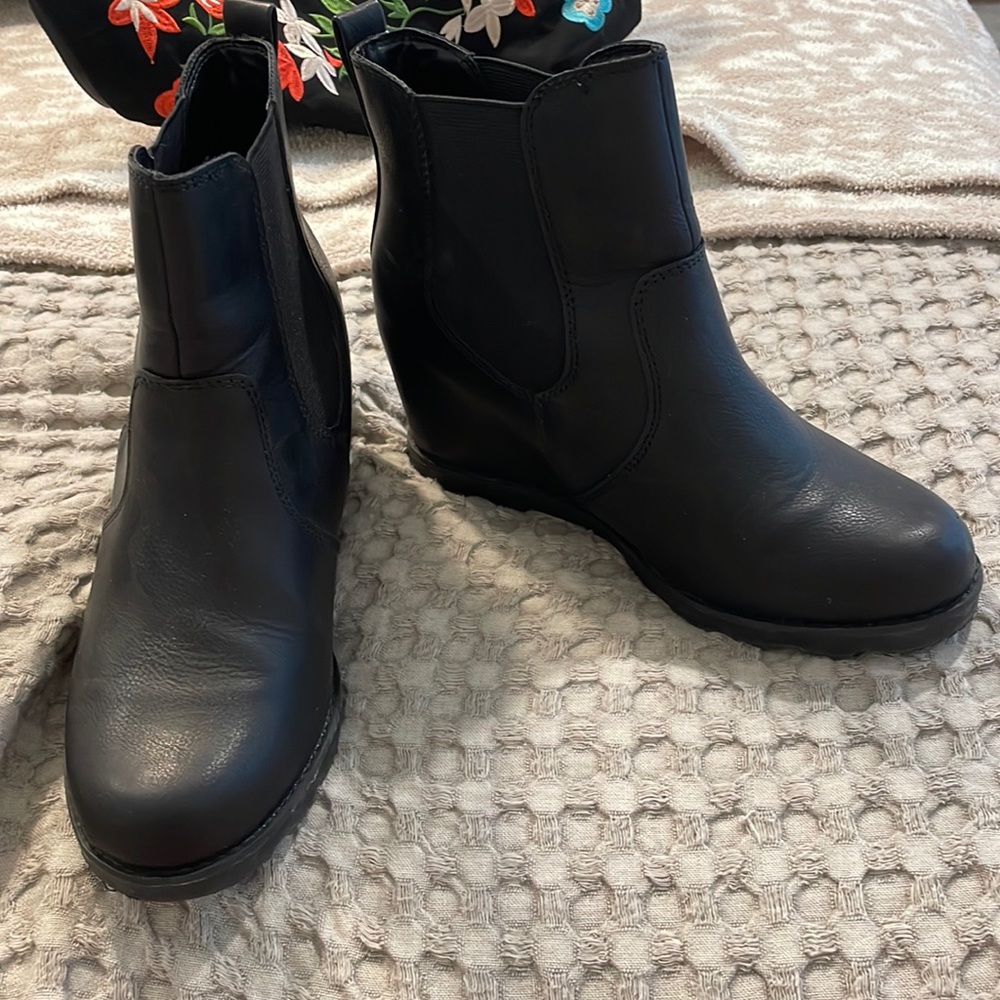 Black leather wedge booties